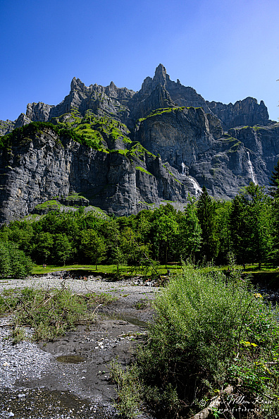 Mountain peak Corne du Chamois (Chamois Horns, 2523m) seen from the river Le Giffre