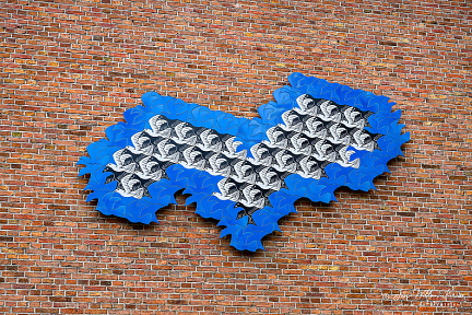 Wall tableau of a tessellation by Dutch artist M. C. Escher on the Princessehof ceramic museum, Leeuwarden.